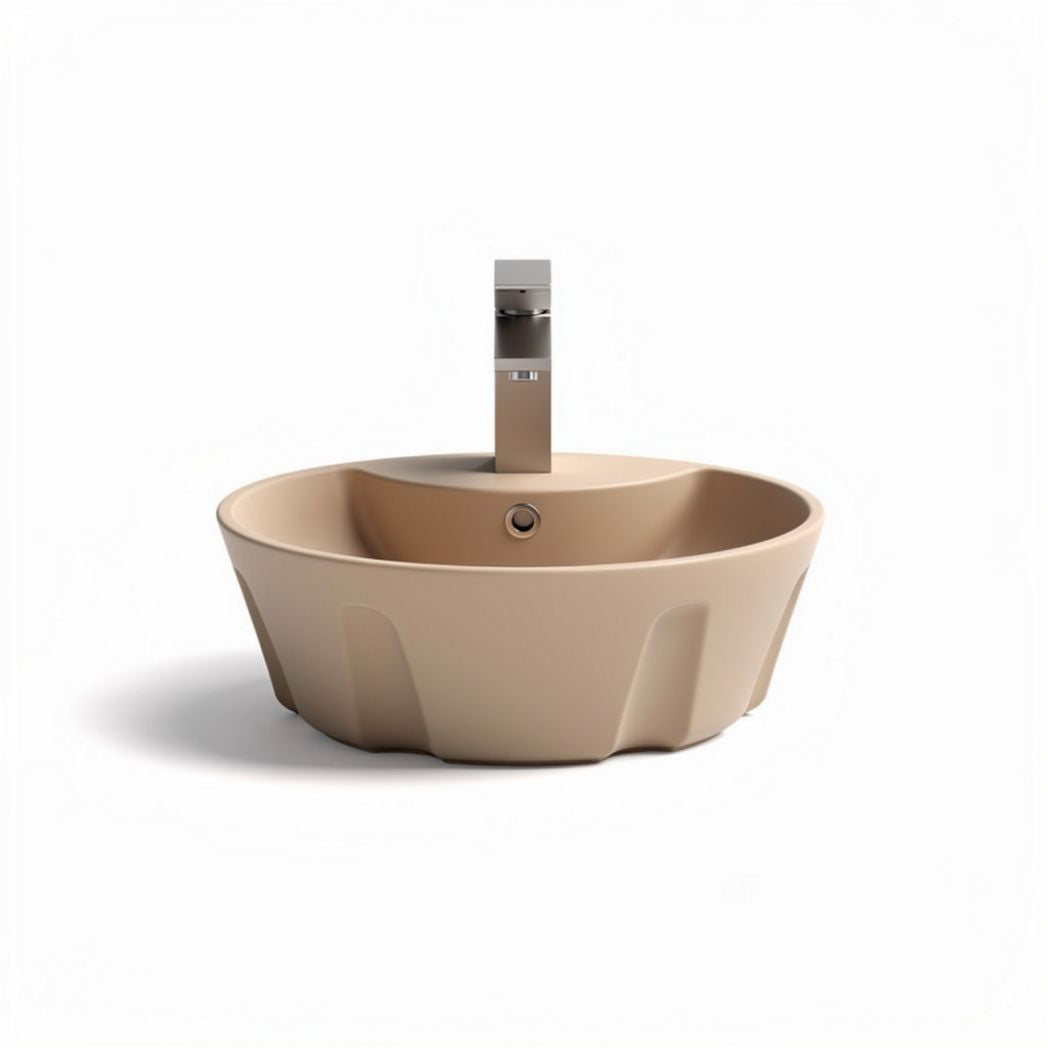 Round beige ceramic sink with modern faucet for bathroom or kitchen installation